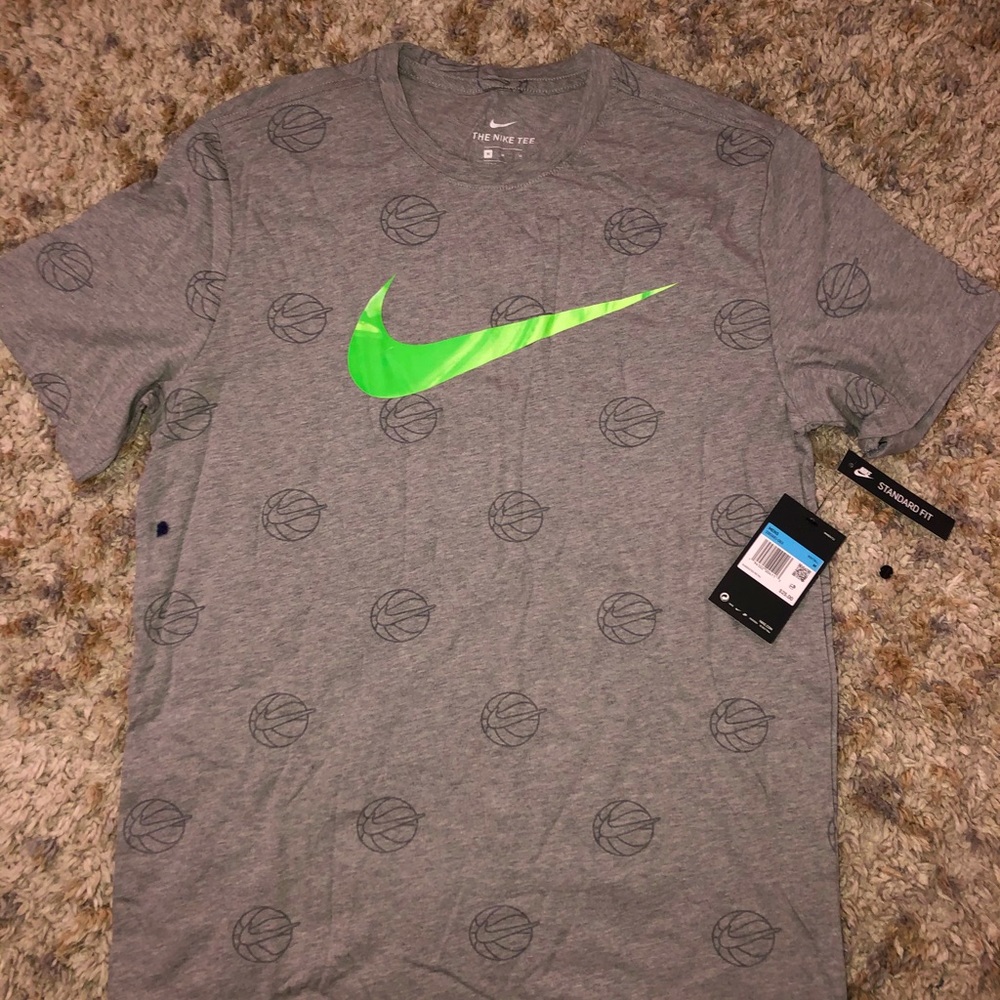 Nike t-shirt; basketball themed; Standard fit.